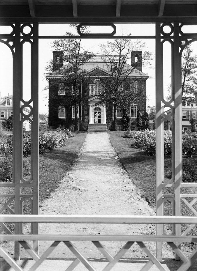 View of Mount Pleasant house from garden through railing of pagoda
